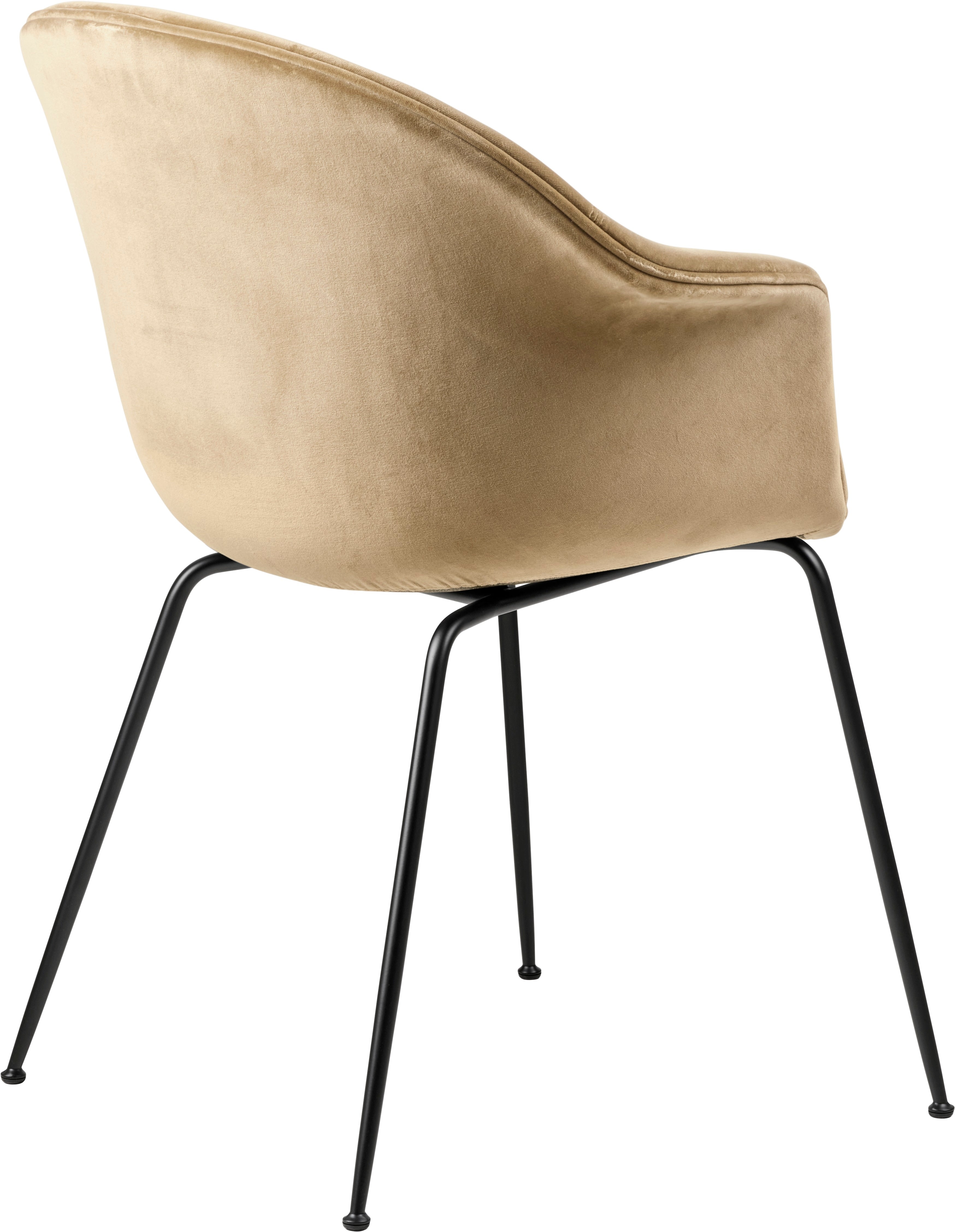 Upholstered BAT chair with a black metal base