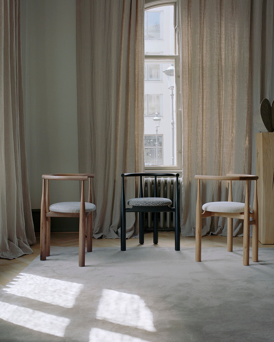 Bukowski chair upholstered with a black beech base
