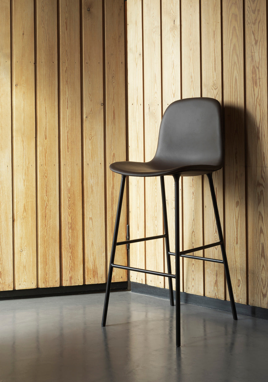 Bar chair upholstered forms with a gray base