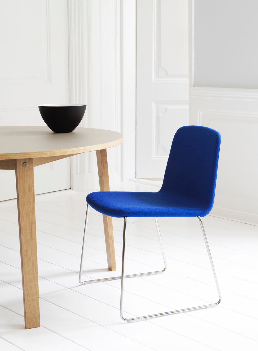 A chair upholstered Just with a black base