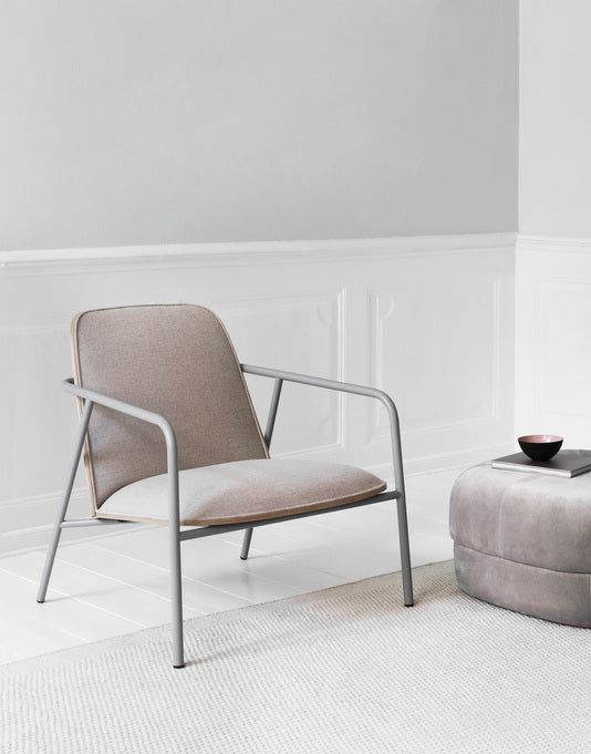 Upholstered armchair pad low black ash veneer with a gray base