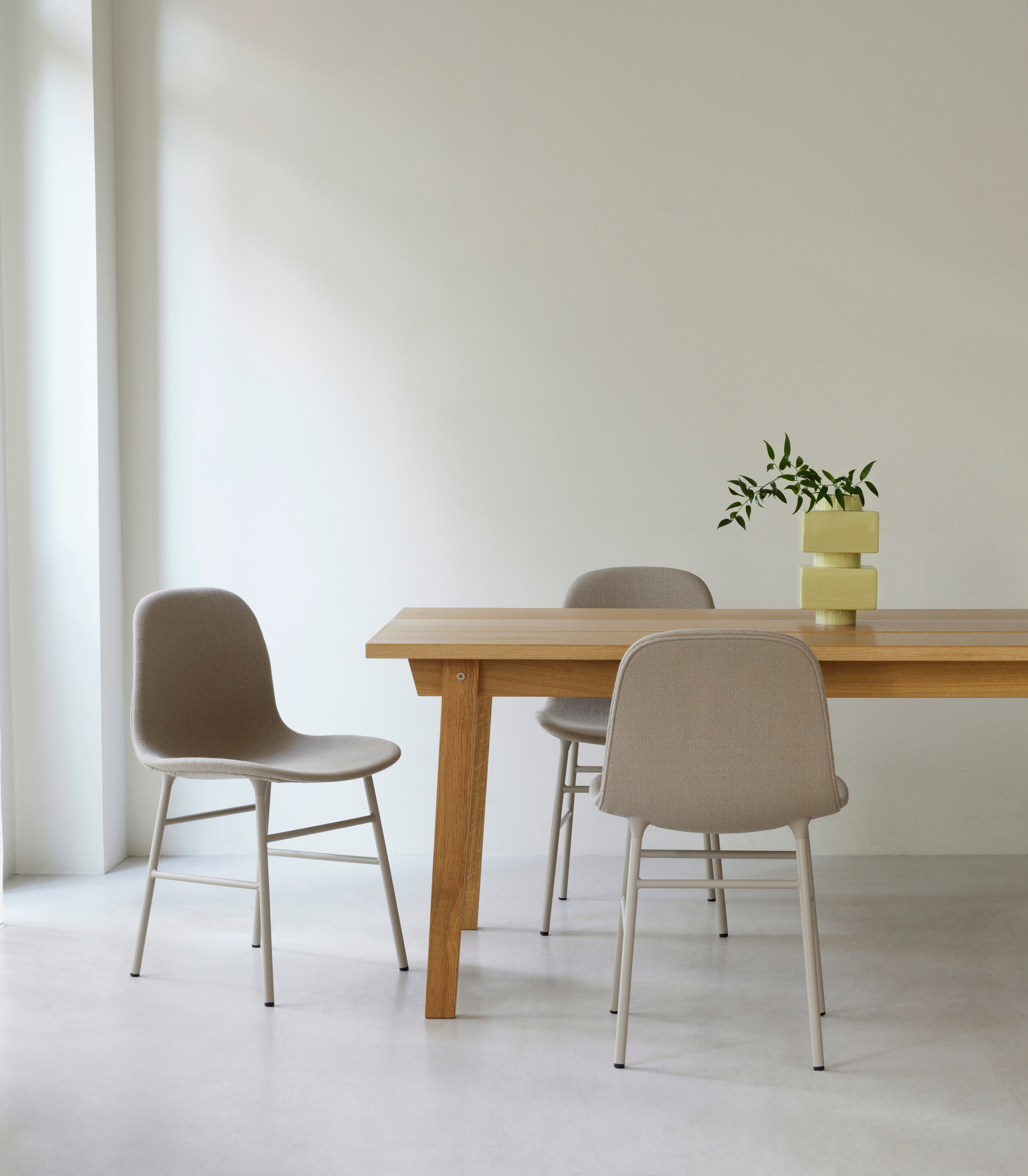 Upholstered chair with a gray base