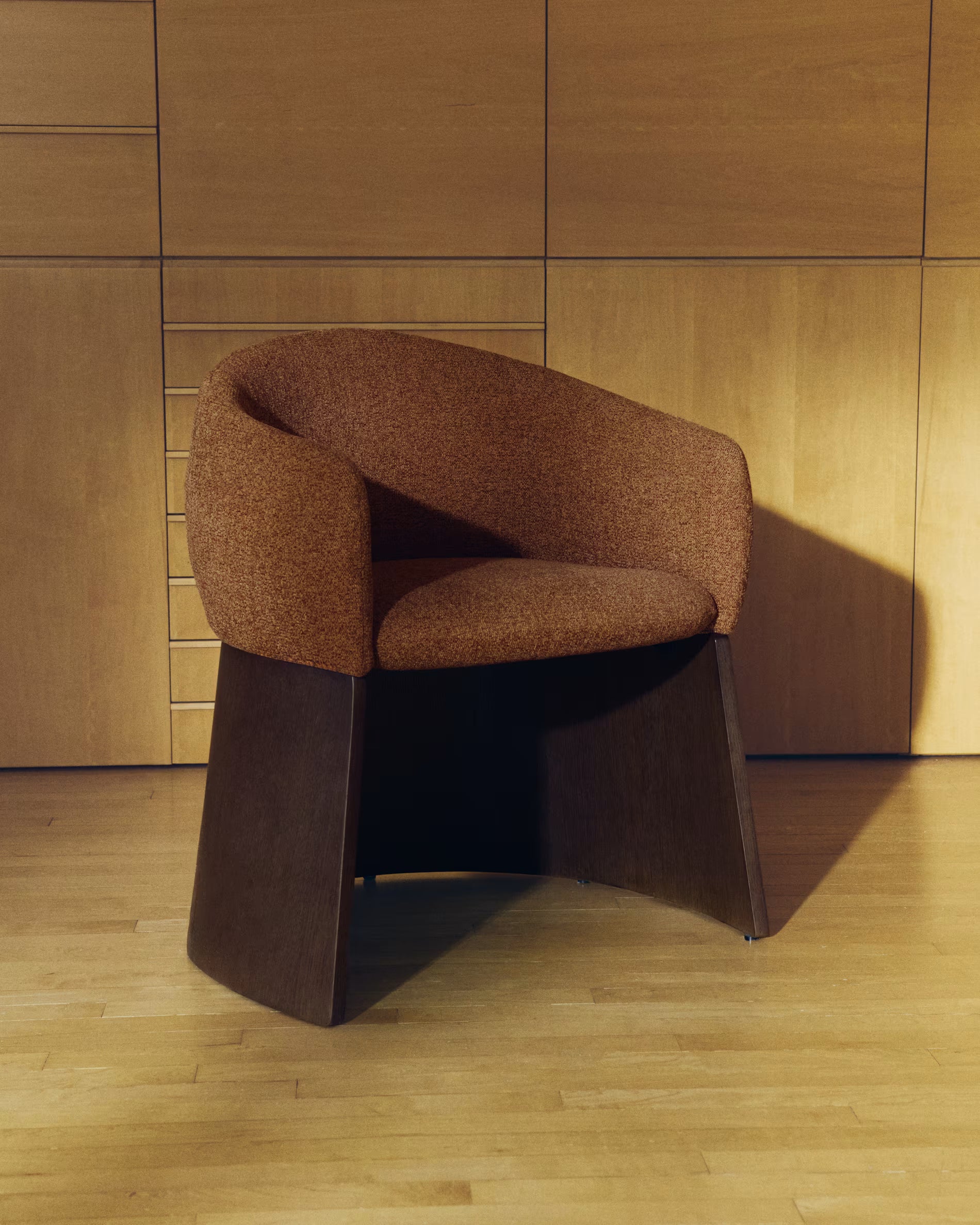 BOSCA chair in brick-colored chenille with a walnut veneer base
