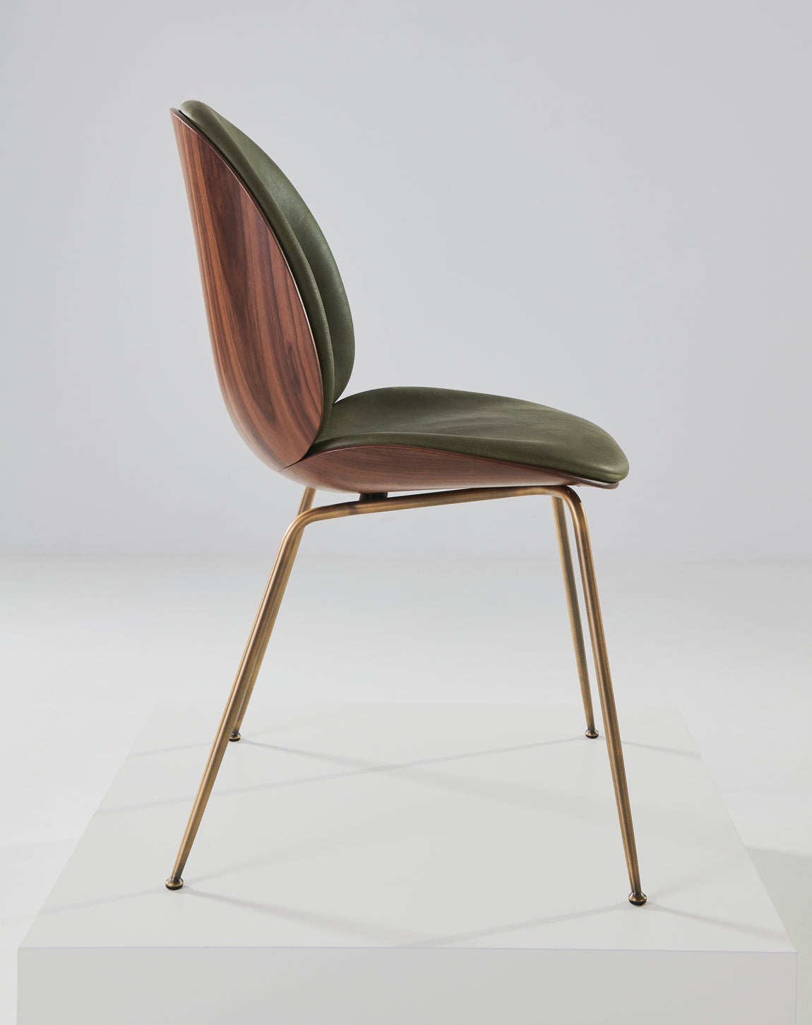 BEETLE upholstered chair with walnut wood and brass base