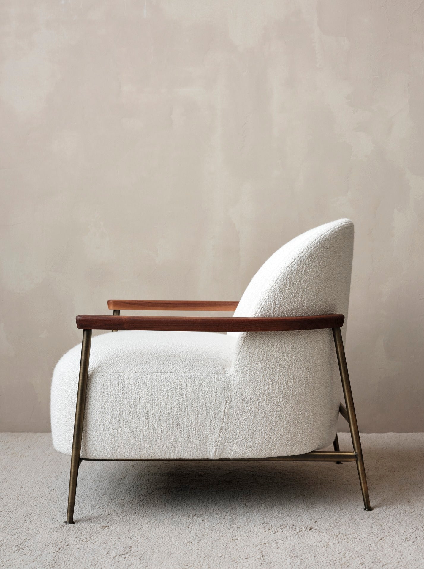 SEJOUR upholstered armchair with a brass base