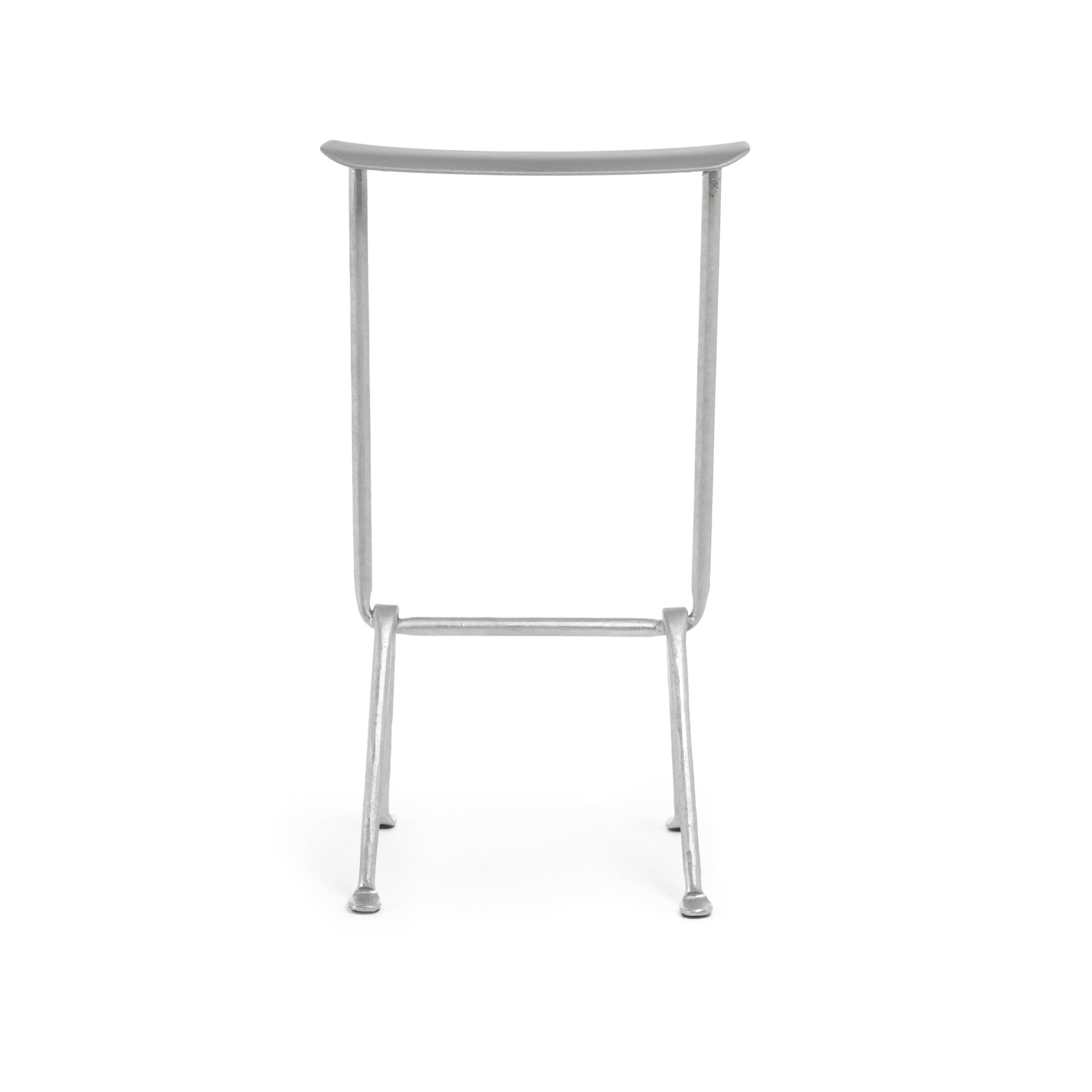 OFFICINA bar stool with a metal base and metallic seat