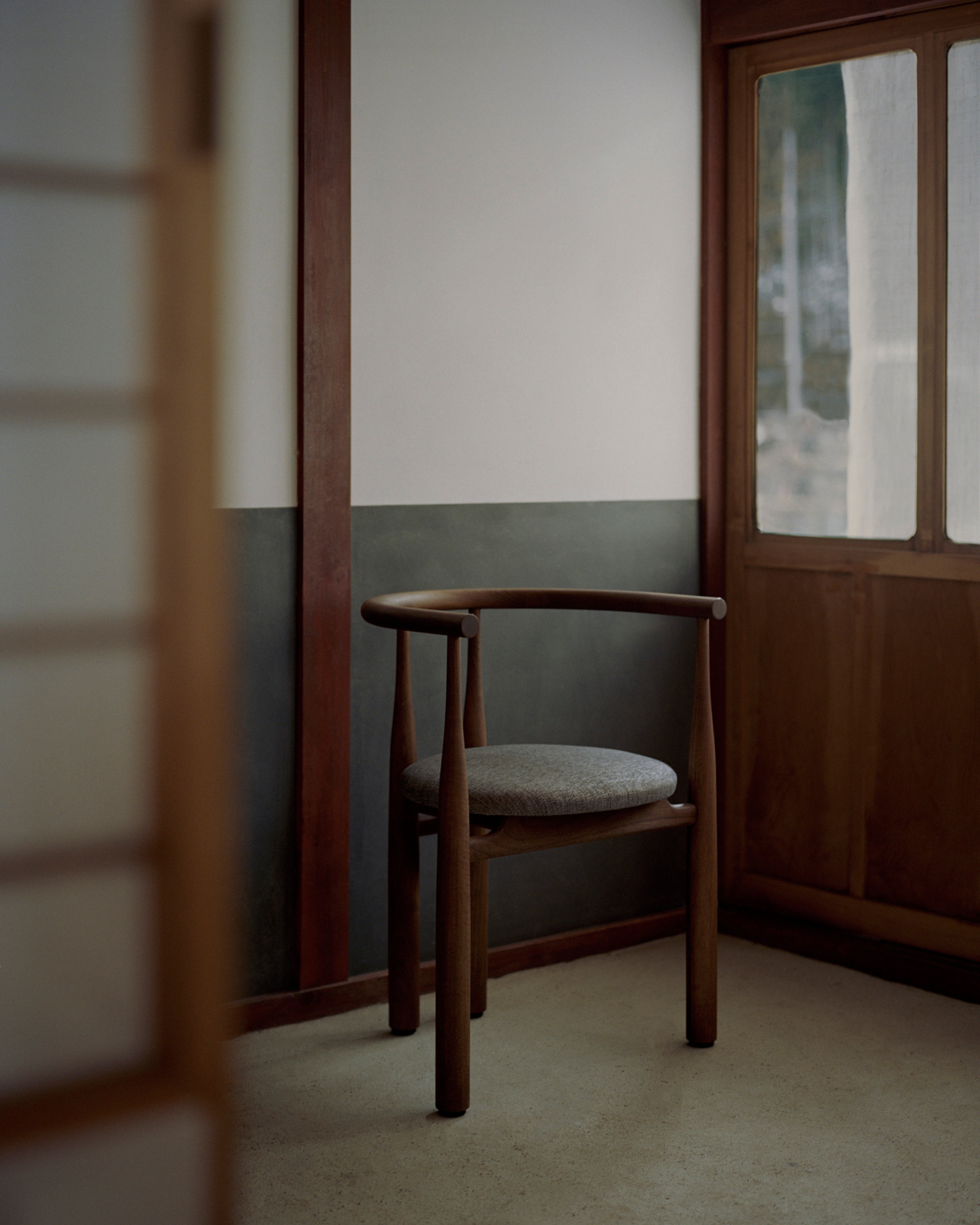 Bukowski chair upholstered with a nut base