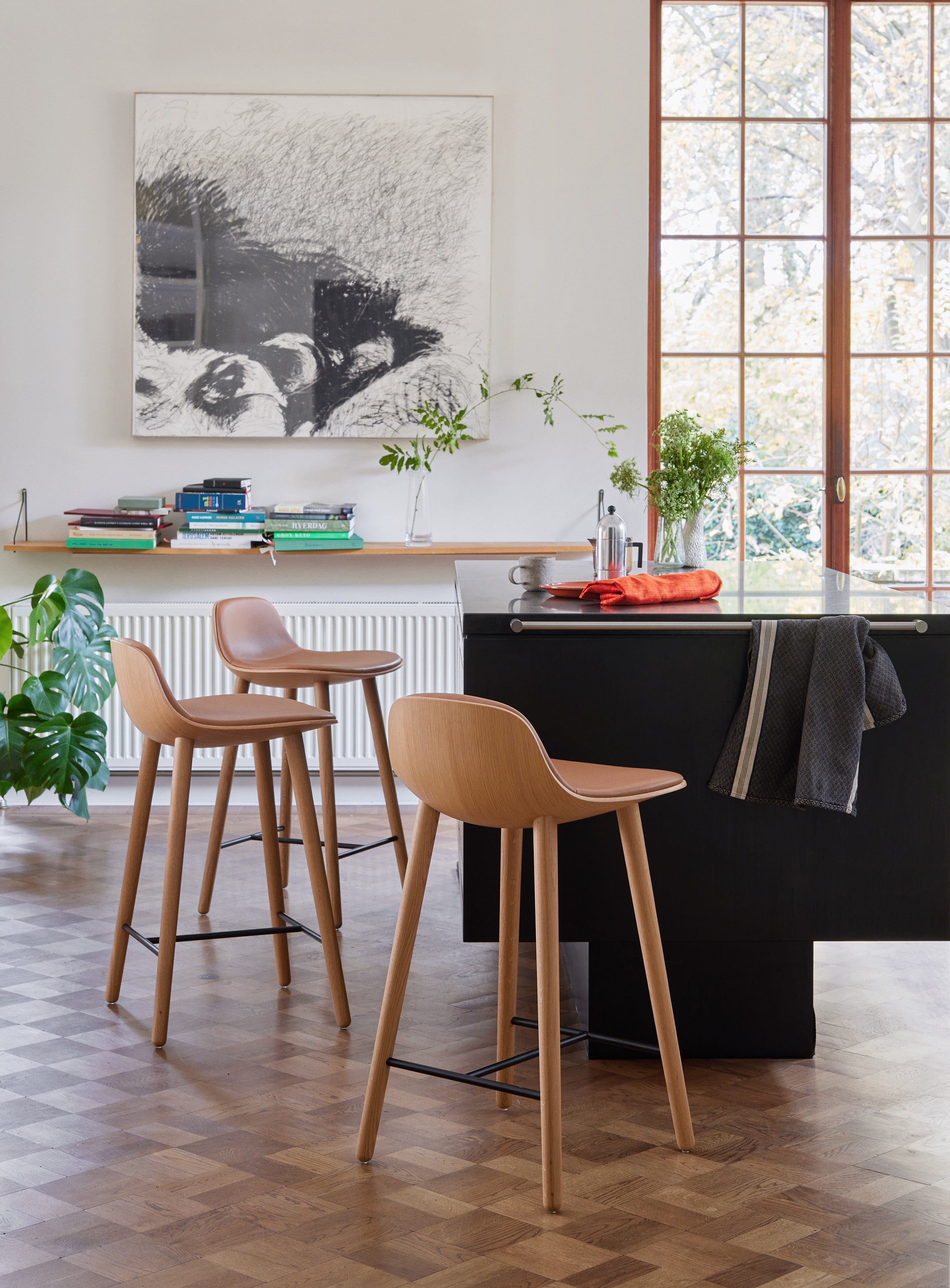 YUUGA stool in brown with a wooden base