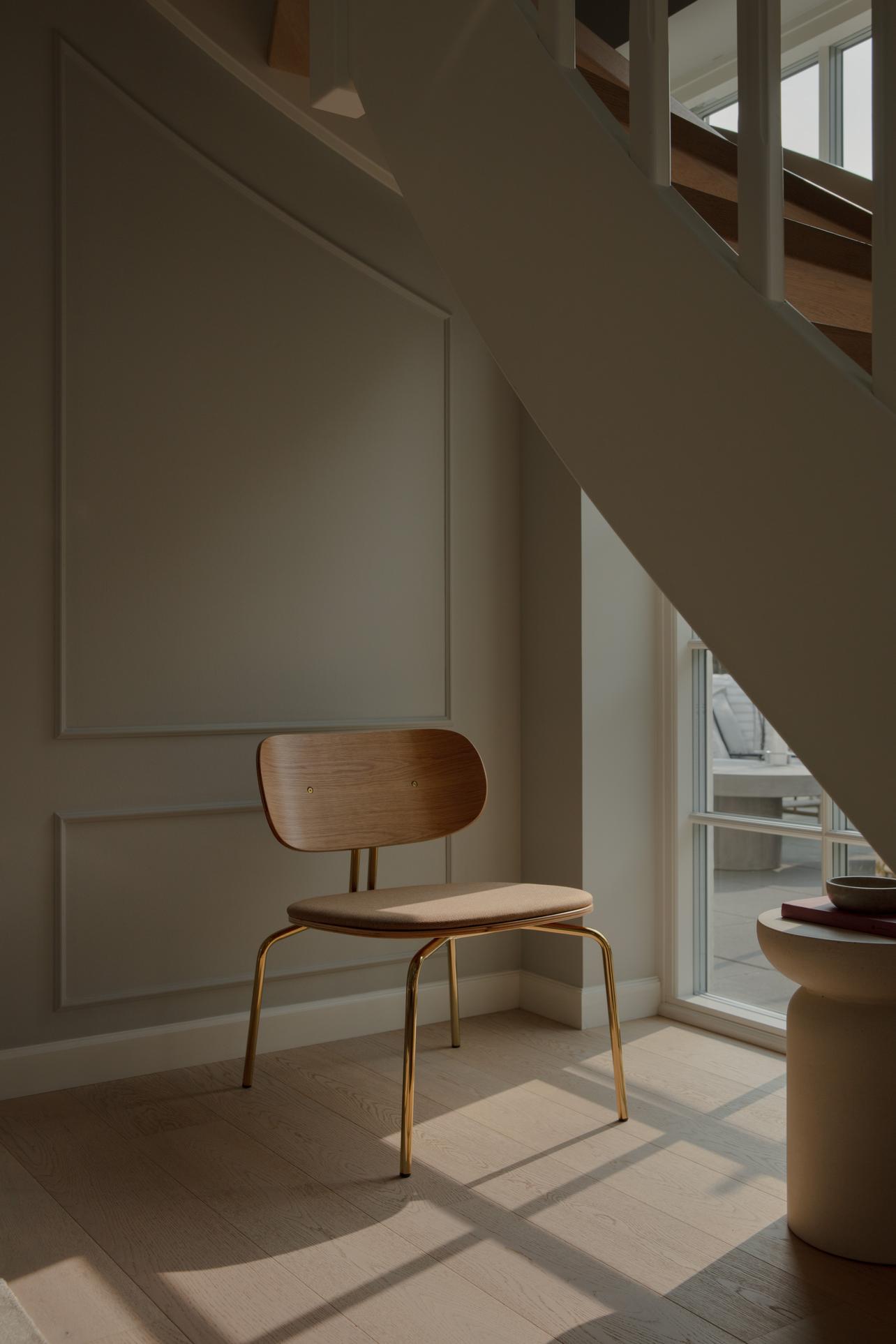 Curious armchair brown plush with a black base