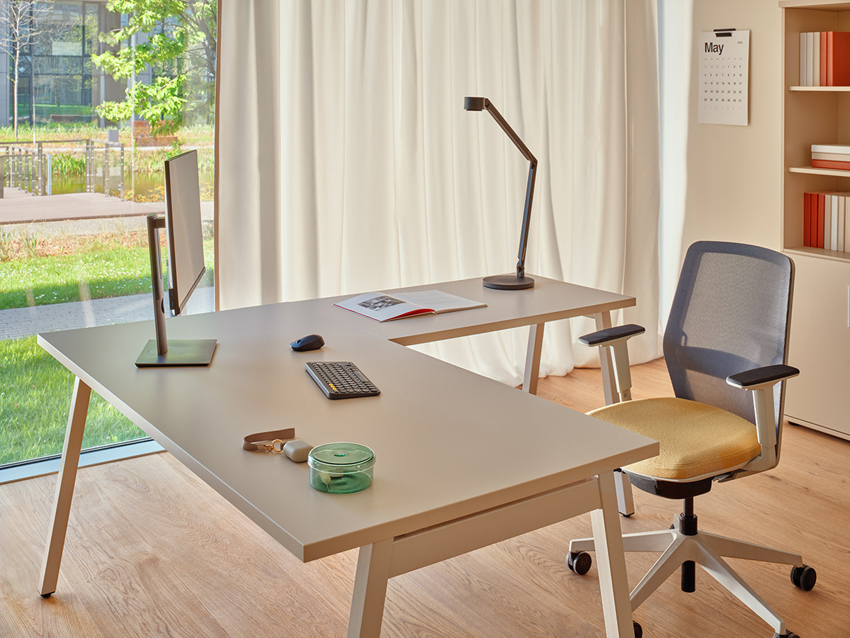 Armchair with an openwork EVO backrest adjustable base with wheels to the hard surface