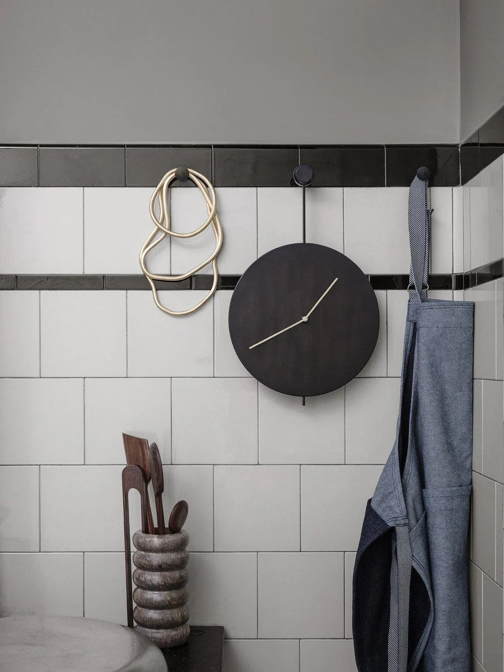 TRACE wall clock in black with brass finish