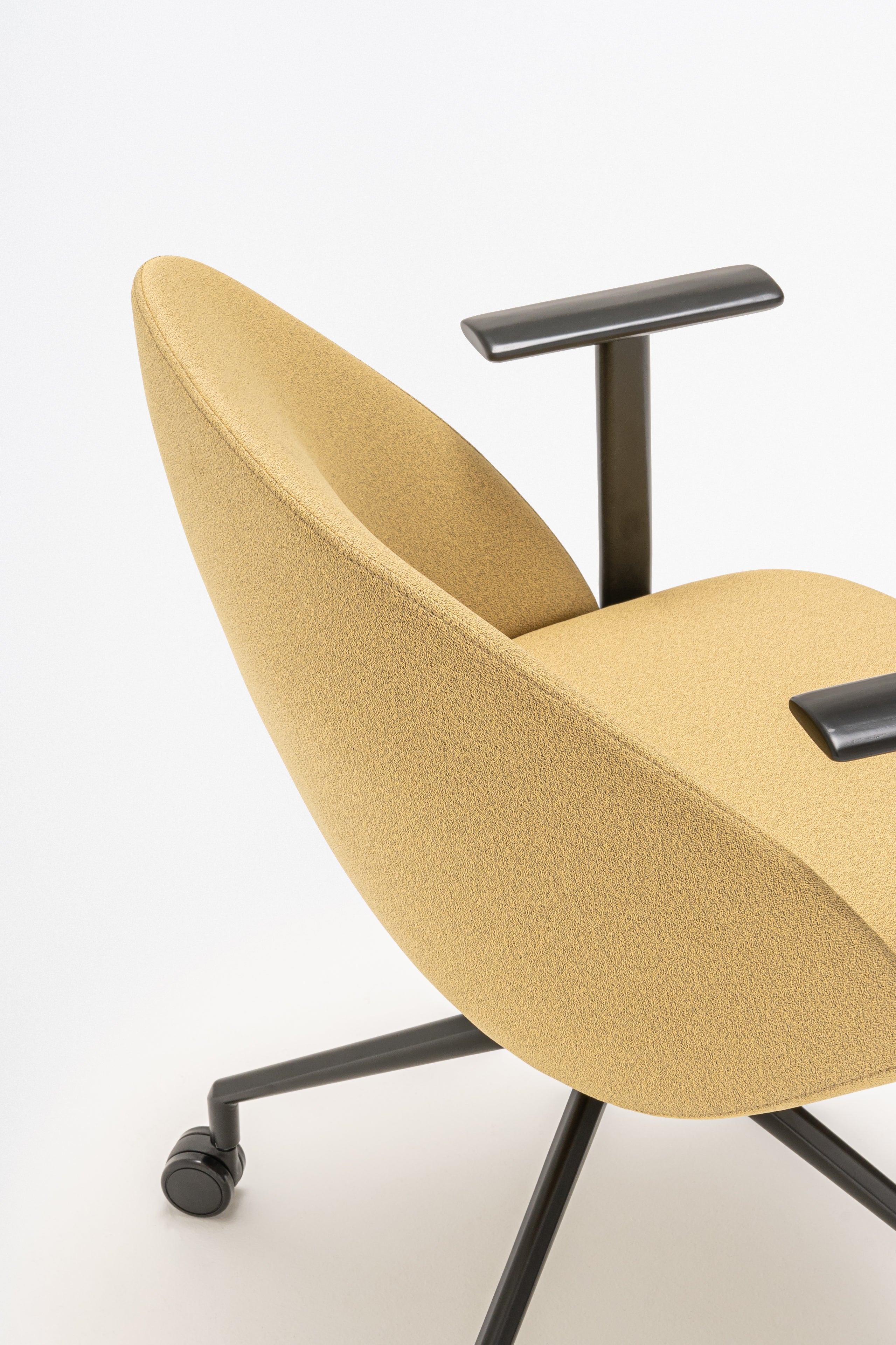 Swivel armchair with low back, a metal parallel base with wheels to a hard surface