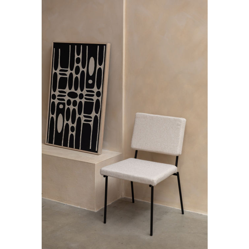 Chair with fellow beige armrests with a black base