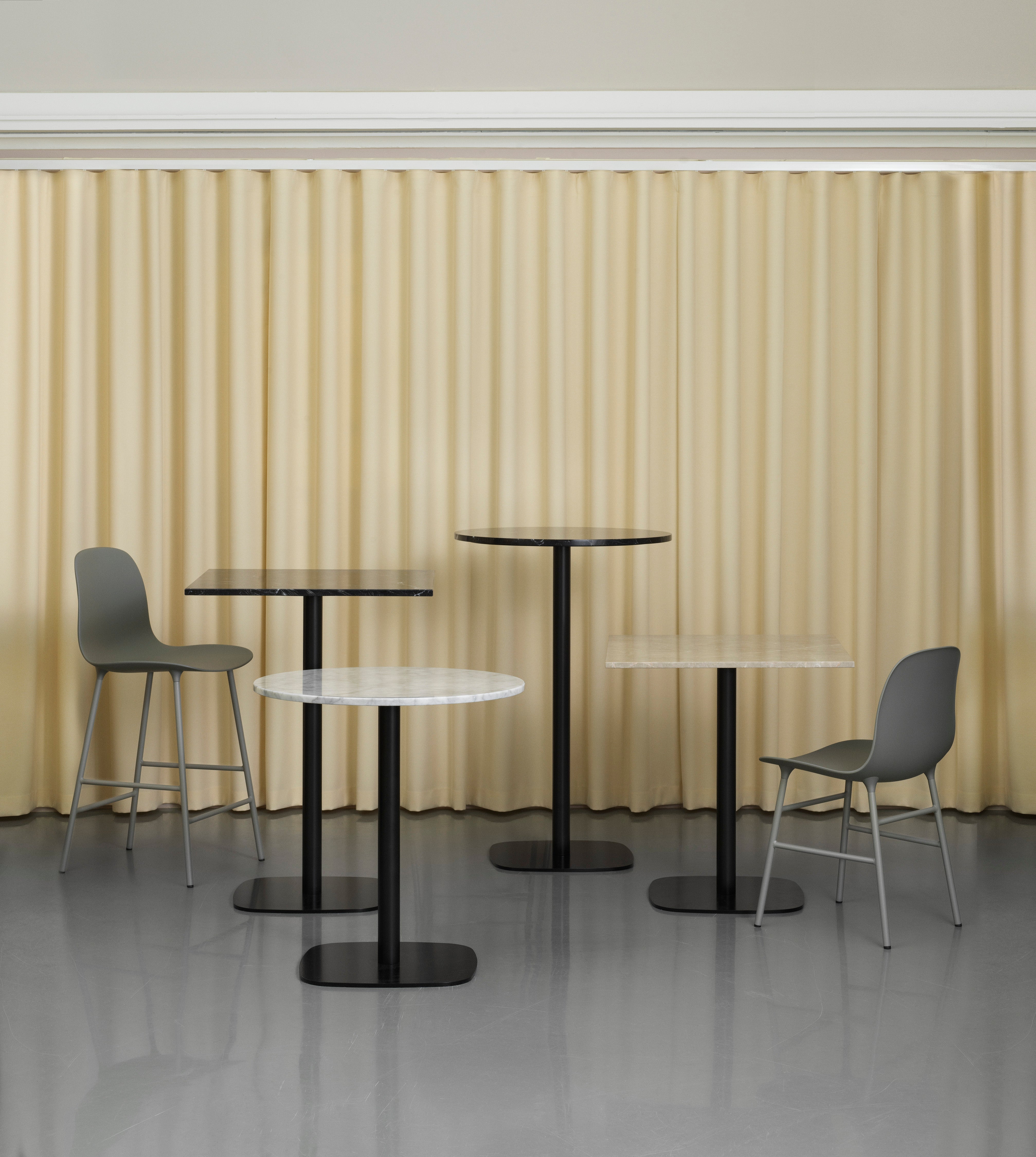 A square cafe table forms wooden top with a black base