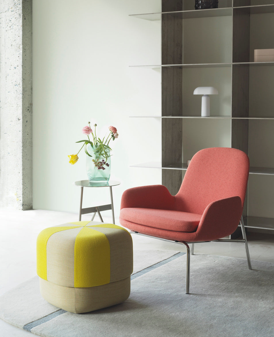 Upholstered armchair era low black base