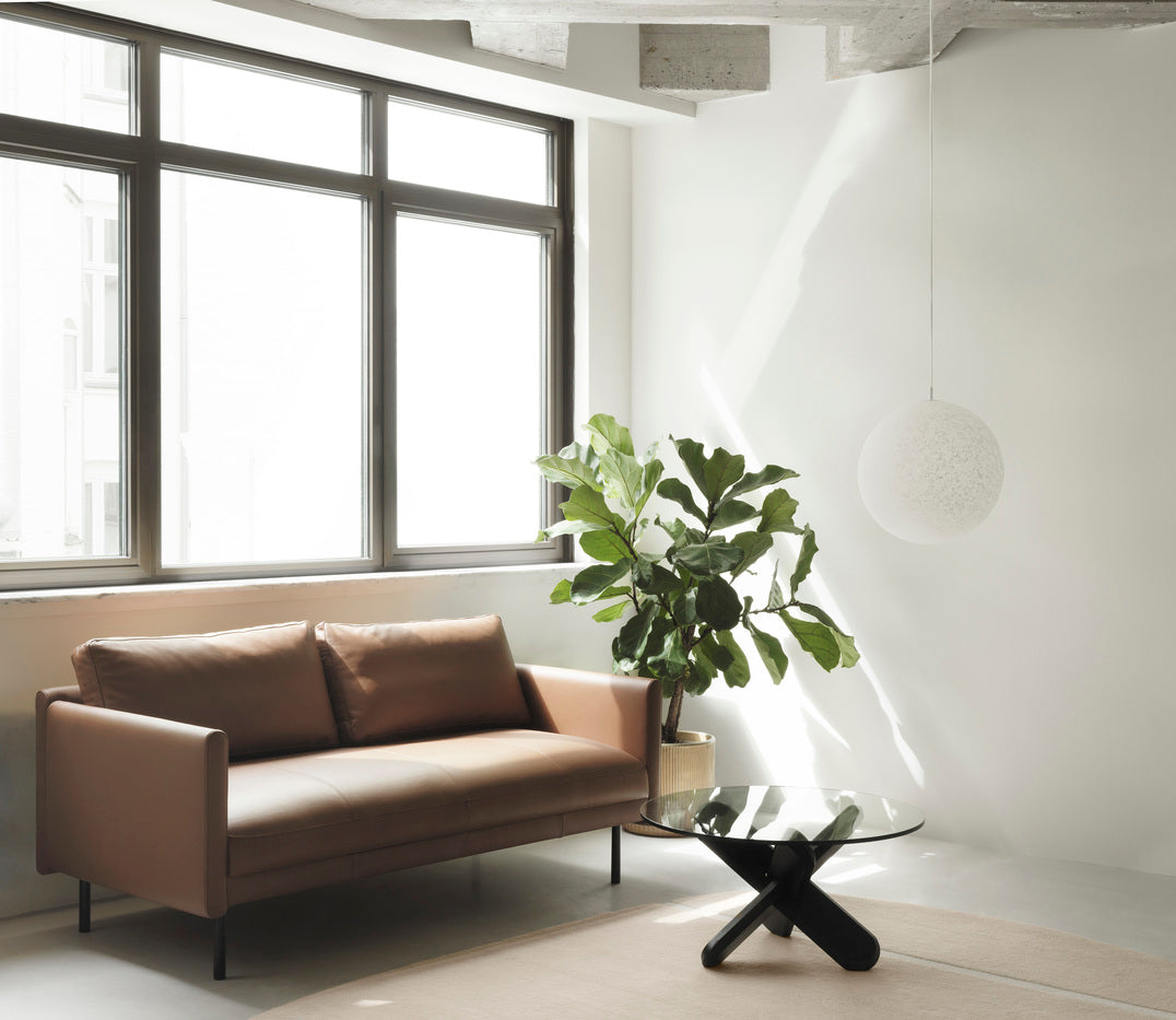 Light gray rar sofa with a black base