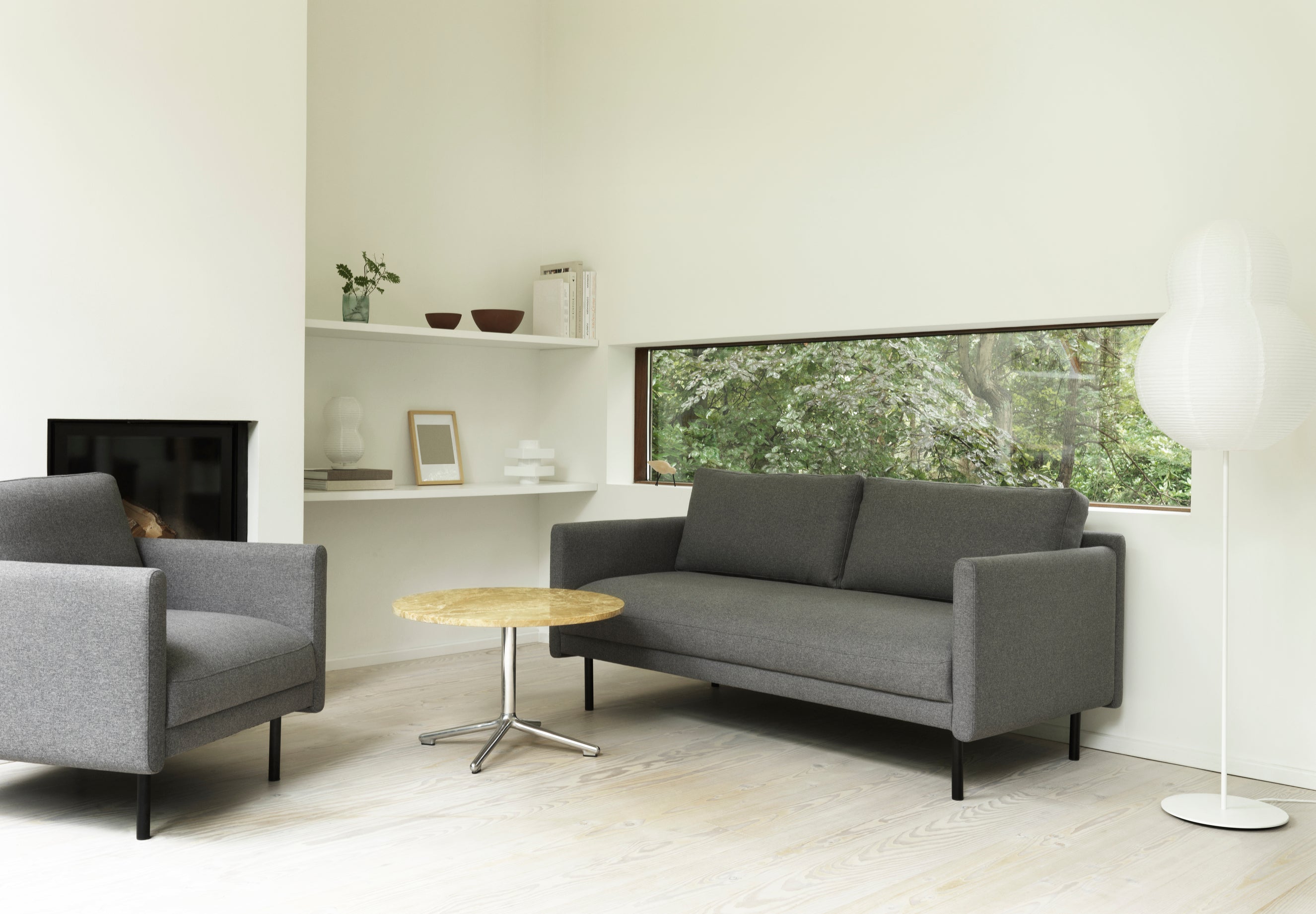 Light gray rar sofa with a black base