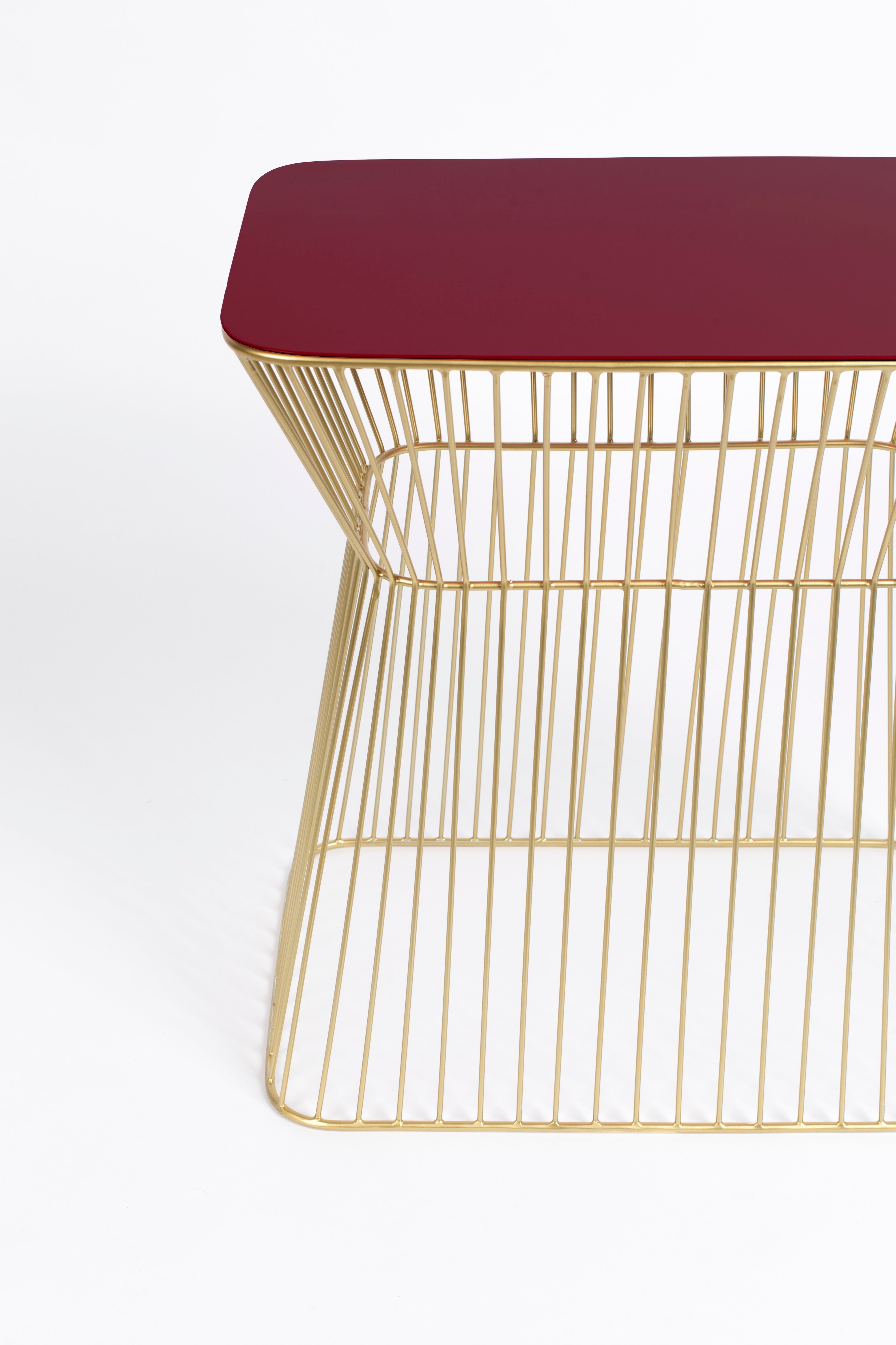 NO OFFENCE side table red wine with a gold base