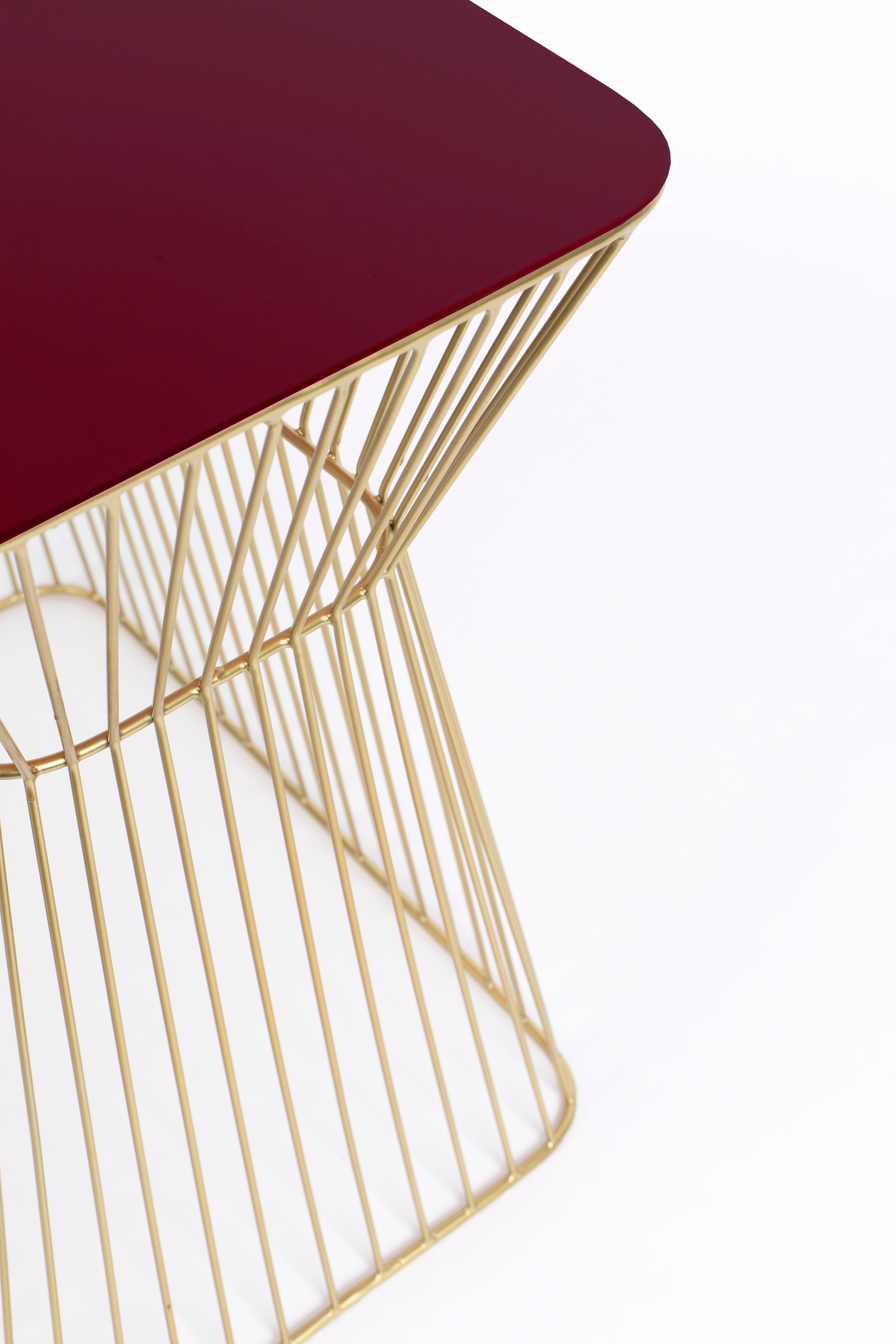 NO OFFENCE side table red wine with a gold base