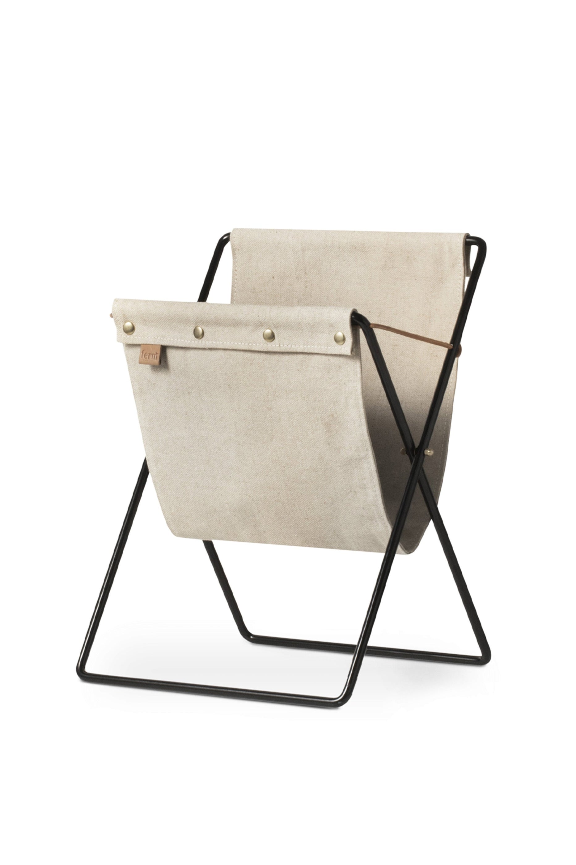 HERMAN beige magazine rack with a black base