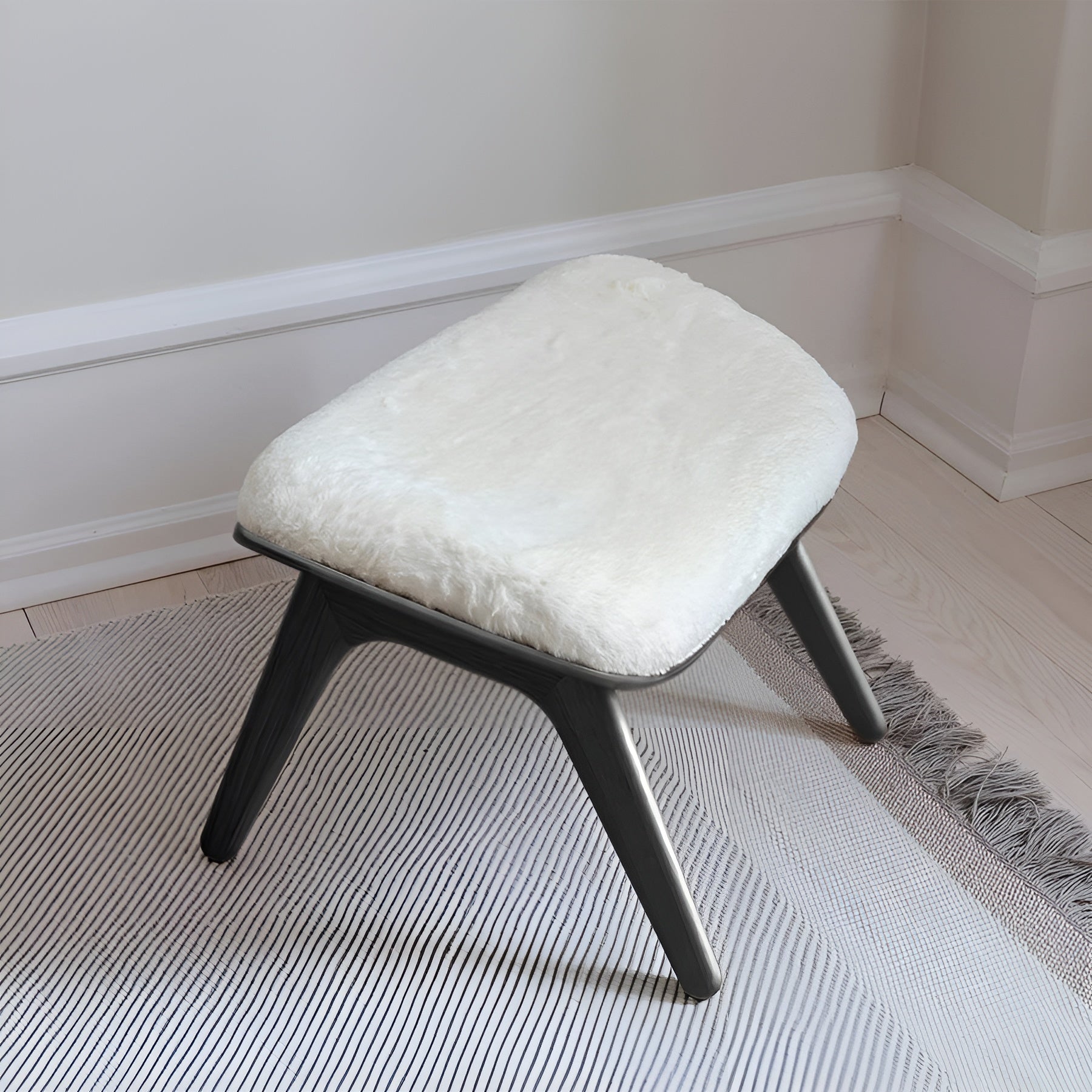 READER white plush footrest with black base