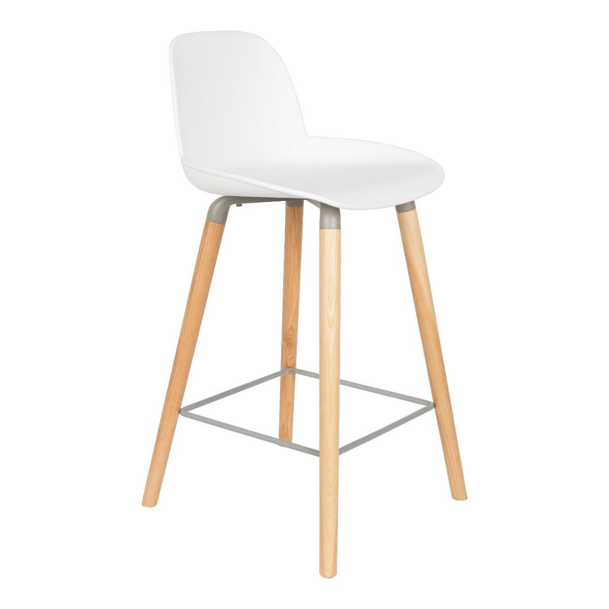 The Albert Kuip bar stool, designed by the Amsterdam Studio Ape, is an amazing combination of modern and retro style. The streamlined seat is supported by wooden, minimalist ash wood legs. It is an ideal addition to a modern kitchen island or a climate, hotel bar. It is also worth paying attention to a specially prepared leg place that improves sitting comfort.