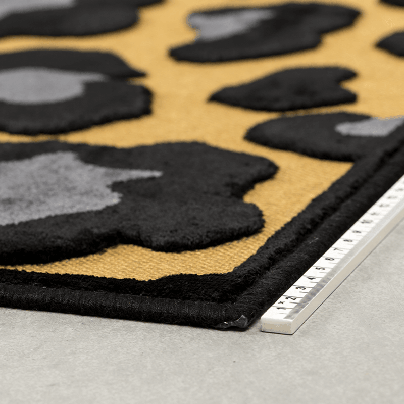 The bold monkey it's a wild world rug Mama Panther is a simple way to change the character of the room. It is a vocal point for minimalist interiors or a fun sparring partner for each room that is not afraid of a collision of prints.